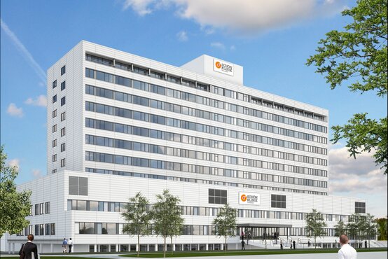 Klinikgebäude der Schön Klinik Düsseldorf mit Zugang, großen Fenstern, breiter Eingangstreppe und Kliniklogo