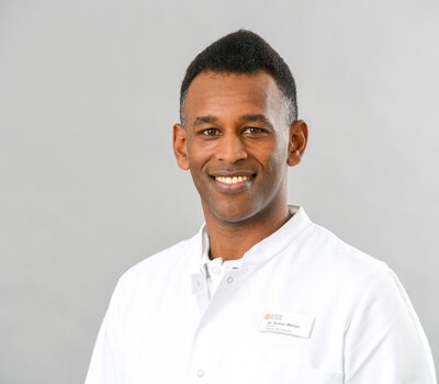 Dr. Symon Mehari